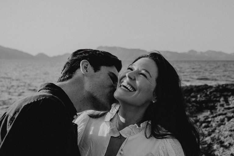 couple kissing and laughing at sunset in Mallorca