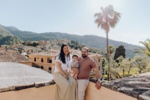 Photo of a family of 3 at La Residencia in Deia with the view of the village in the background
